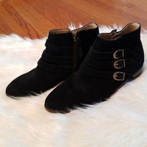 Black leather ankle boots with buckle
